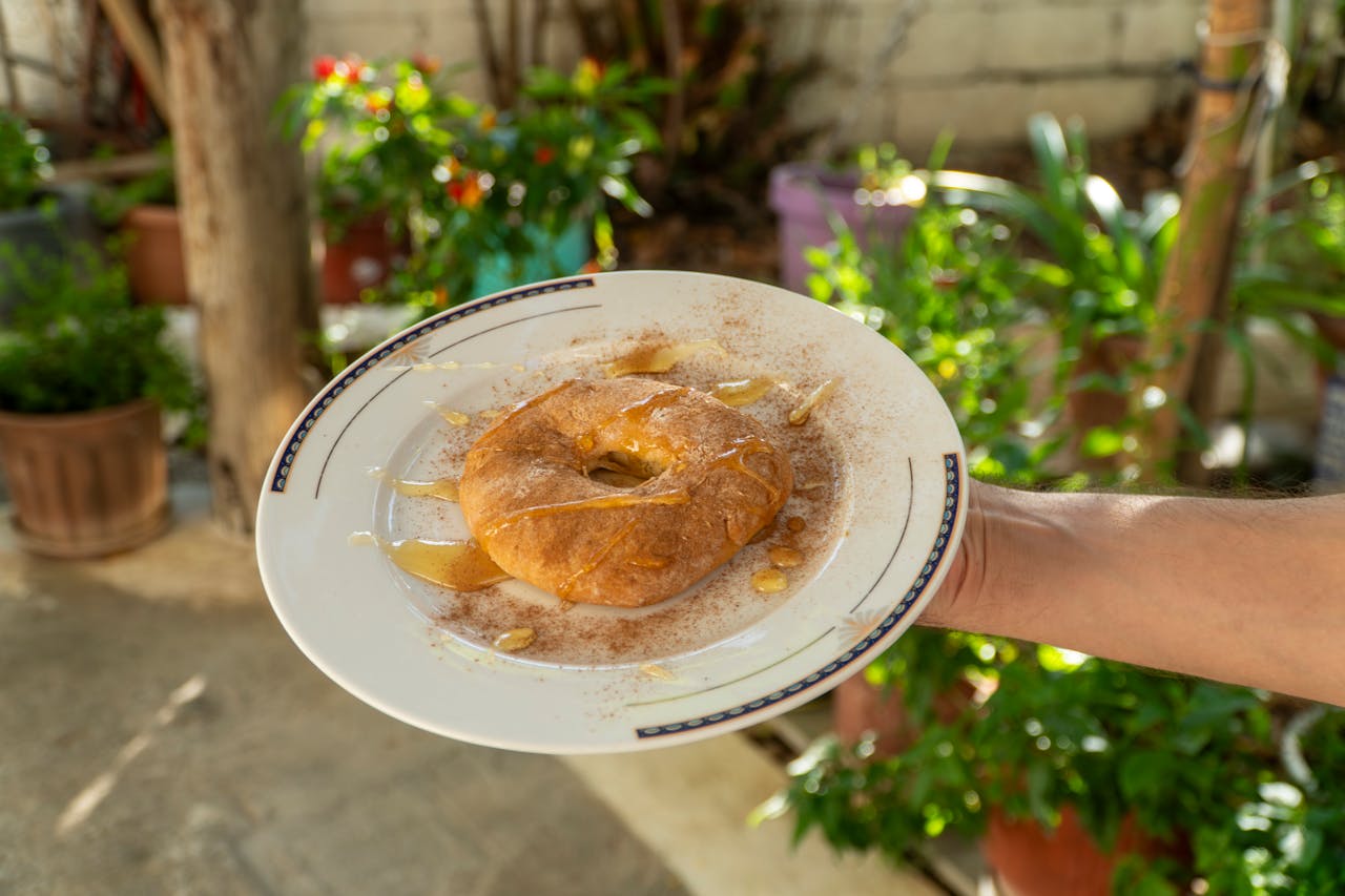 gallery-3 Delicious sweet tiganopsomo topped with honey. Shot in an outdoor setting in Schimatari, Greece.